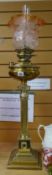 A Thermidor Belge brass architectural antique oil lamp on a stepped base with Romanesque support and
