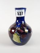 A Moorcroft blue ground floral narrow neck vase, 12cms high Condition reports provided on request by