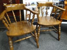 A pair of reproduction oak smoker's bow chairs Condition reports provided on request by email for