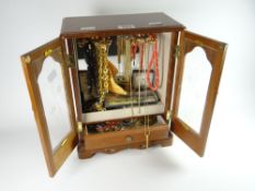 A table top jewellery cabinet containing mainly costume jewellery Condition reports provided on