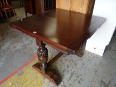 A good vintage draw leaf oak dining table with carved baluster supports Condition reports provided