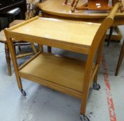 A neat lightwood mid-century tea trolley Condition reports provided on request by email for this