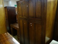 A good vintage linen-fold double wardrobe with matching dressing table Condition reports provided on