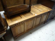 A good antique reproduction panelled blanket chest with carved supports Condition reports provided