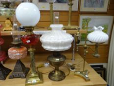 Three vintage / antique oil lamps comprising stepped square based example with Corinthian column and