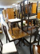 An antique extending reproduction twin-pedestal dining table and six splat back chairs Condition