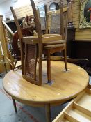 An extending G-Plan circular / oval dining table and two G-Plan cane work chairs Condition reports