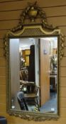 Twentieth century gilt framed rectangular wall mirror having urn and foliate decorated pediment,