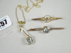 Two aquamarine set bar brooches in 9ct & 15ct yellow gold and an aquamarine / quartz pendant and
