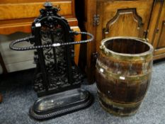A painted late-Victorian cast iron floral stick stand with rope twist oval holder and lined base,