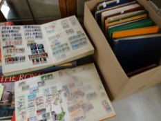 A cardboard container containing 14 stock albums of stamps Condition reports provided on request
