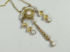 A believed 9ct yellow gold antique pendant set with opals and seed pearls on a fine chain