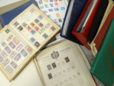 A brown cardboard carton containing numerous stamp albums including small Rowland Hill blue album