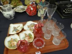 A series of four Coalport porcelain shaped dishes with transfer scenes of female figures and with