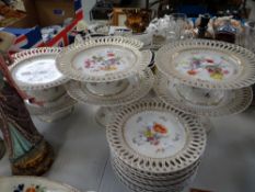 A part Vienna floral dessert service with ribbon borders and including six cake stands Condition