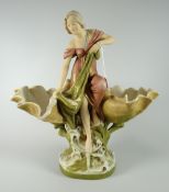 A Royal Dux pottery model of a maiden catching a fish in a net, flanked by two open clam shells over