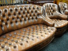 Mid-twentieth century button back leather three-piece suite comprising two-seater settee and pair of