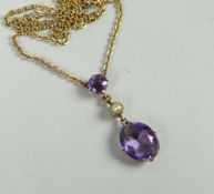 A fine 9ct yellow gold necklace with attached amethyst and seed pearl drop pendant Condition reports