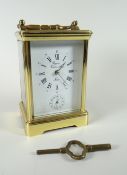 Late twentieth century brass encased carriage clock with rectangular white enamel dial bearing Roman