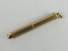 Small 9ct gold engine turned propelling tooth pick, 5.9grams approx. Condition reports provided on