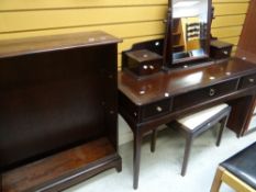 A neat Stag Minstrel dressing table and matching stool and bookcase Condition reports provided on