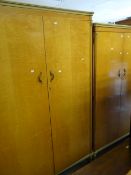Pair of matching mid-century lightwood wardrobes, the ladies wardrobe with compartmented interior