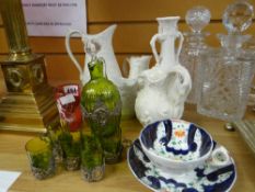 A china and glass parcel including five items of parian pottery, a green glass metal overlaid liquor