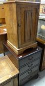 A linen-fold oak night cabinet and a reproduction two-drawer filing cabinet Condition reports