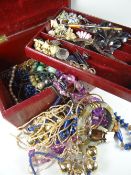 A vintage red jewellery box with mainly costume jewellery contents Condition reports provided on