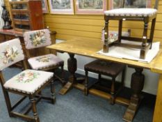 A vintage oak refectory-type breakfast table with floor level stretcher, 136cms long and four floral