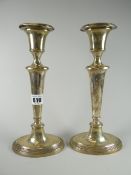 Pair of silver (loaded) candlesticks raised on oval stepped bases, Chester hallmarks (2) Condition