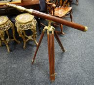 A wooden and brass reproduction telescope and tripod Condition reports provided on request by