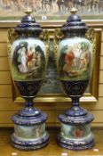Pair of Royal Austria Vienna twin-handled vases and covers on cylindrical pedestal bases, hand