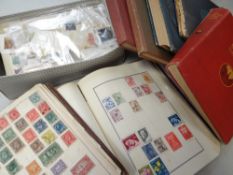 A white cardboard carton containing various albums of stamps including 'The Diplomat' red album with