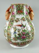 A Famille Rose twin-handled vase Condition reports provided on request by email for this auction