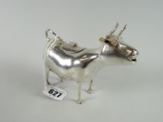 A continental Schuppe-style silver creamer in the form of a horned cow with loop tails as handles