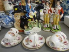 Staffs pottery flat pack figurine entitled 'Dick Turpin', two Continental porcelain figures, a