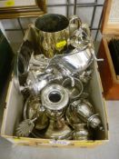 Box of plated ware including a chamber stick and snuffer, gravy boat, cruet set etc