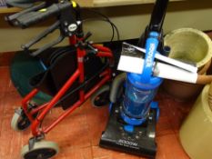 Hoover 2000w upright vacuum cleaner and a red mobility walker E/T