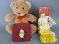 Two small vintage bisque headed dolls and a small modern teddy bear