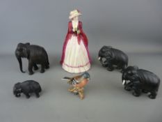 Doulton style lady figurine titled 'New Gloves', a group of four mixed composition elephants and a