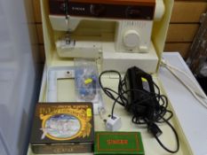 Plastic cased Singer 5525 sewing machine with foot pedal and accessories and a folding wooden
