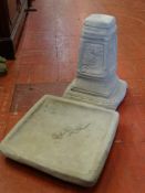 Reconstituted stone bird bath garden ornament on a square plinth