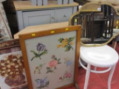 Ornate metal framed mirror and two firescreens with floral inserts and a white painted bentwood