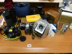 Parcel of cameras and photographic equipment to include a Kodak Brownie Box camera, a Sigma lens etc