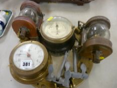 J Barker & Co yacht aneroid barometer, a brass porthole type mirror, a pair of brass and copper