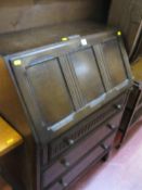 Priory style writing bureau with presentation plaque