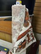 Roll of classically decorated material for upholstery work