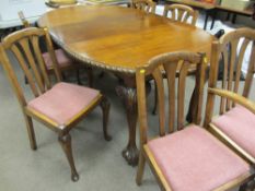 Mahogany wind-out dining table with six (five plus one) non-matching triple splatback chairs