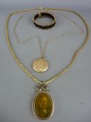 Unmarked and untested photograph pendant on yellow metal chain, a yellow metal locket on nine